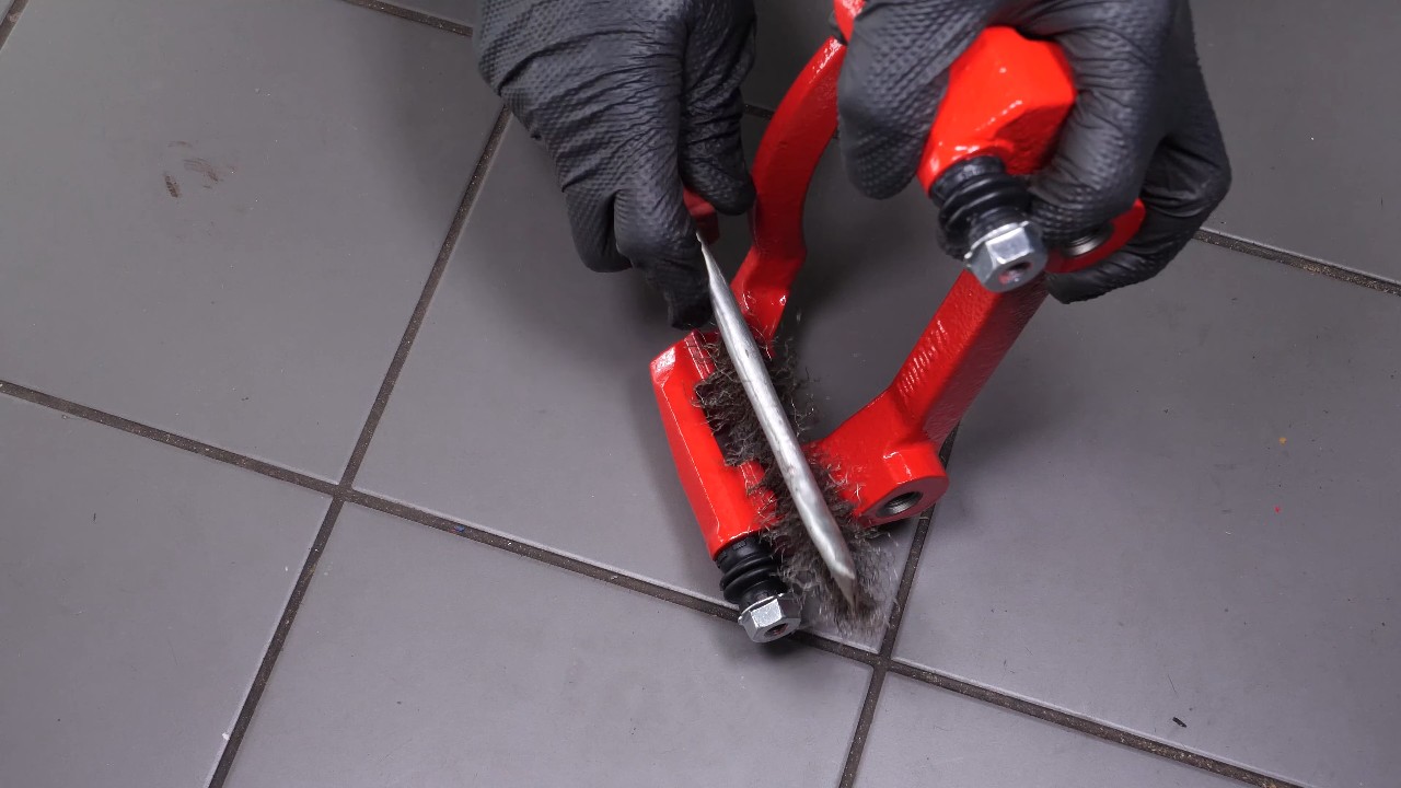 Clean the brake caliper mount