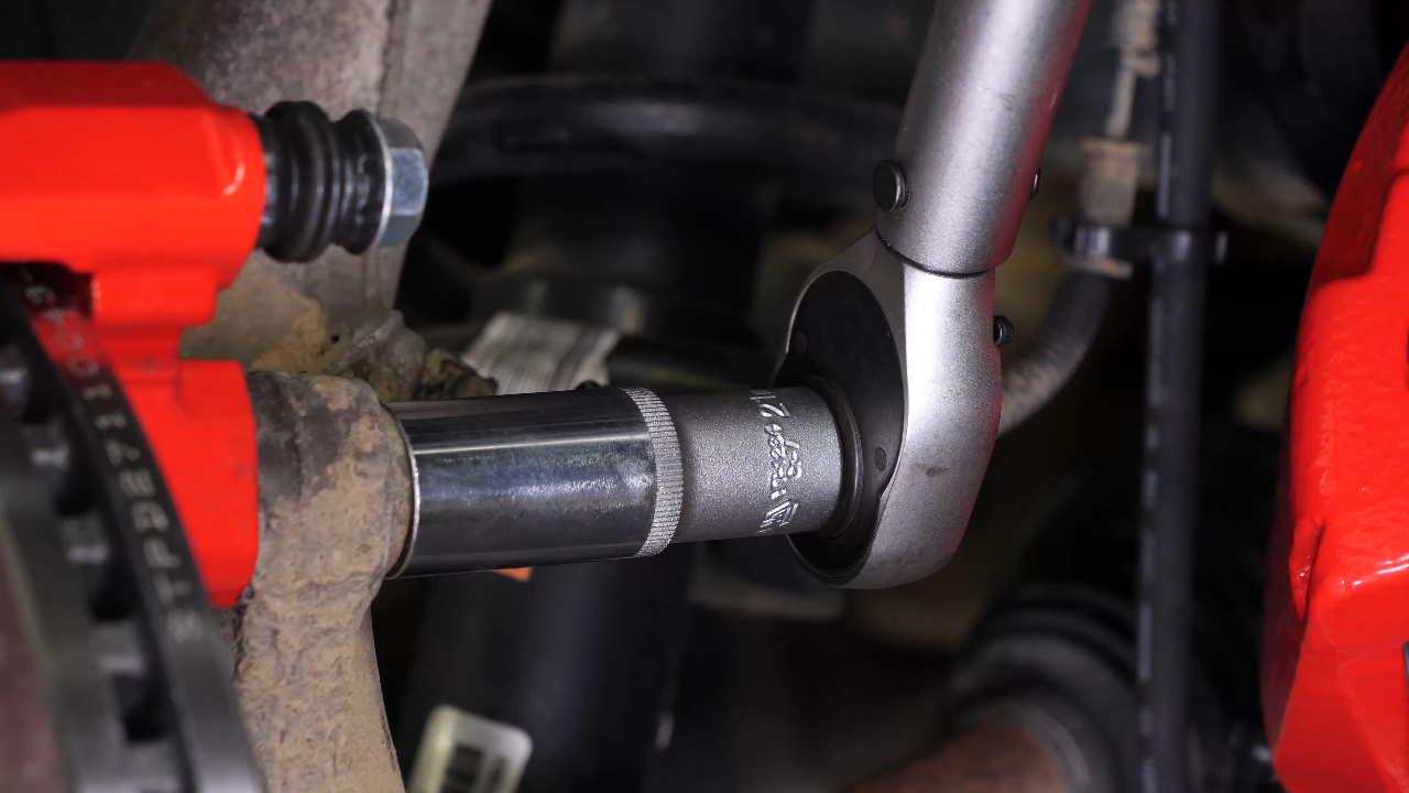 Put the brake caliper mount back on