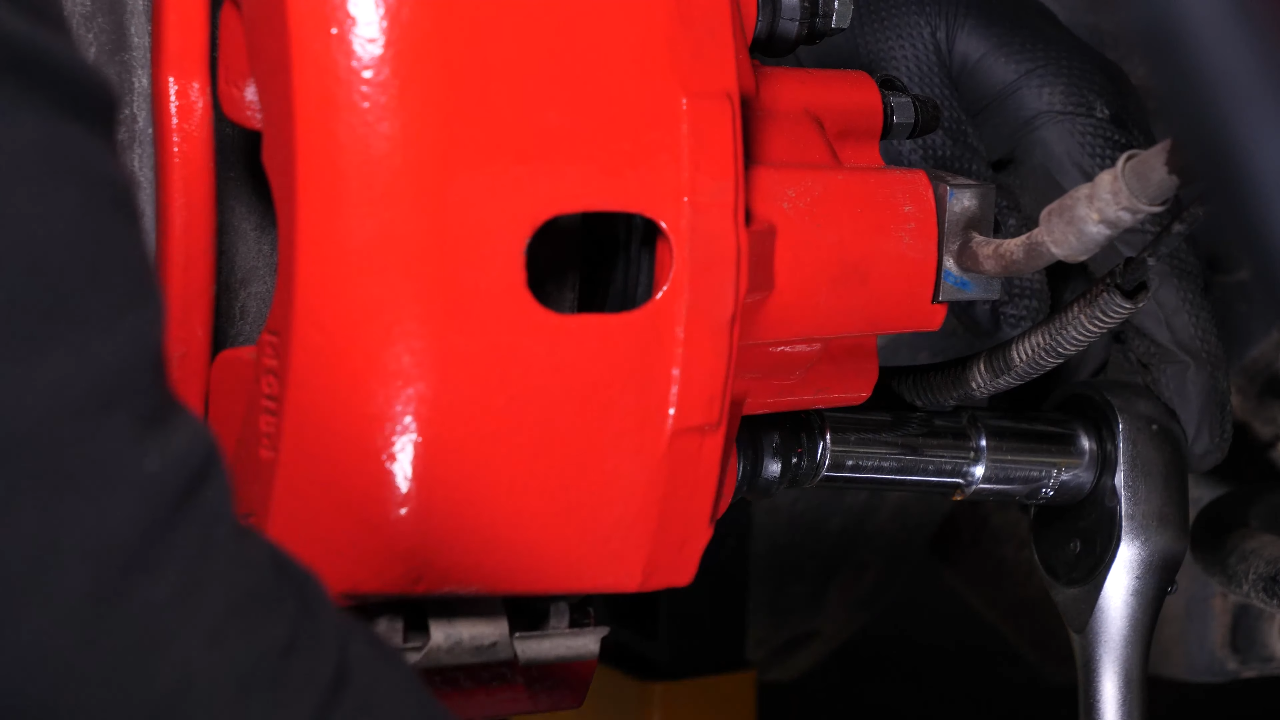 Remove the brake caliper