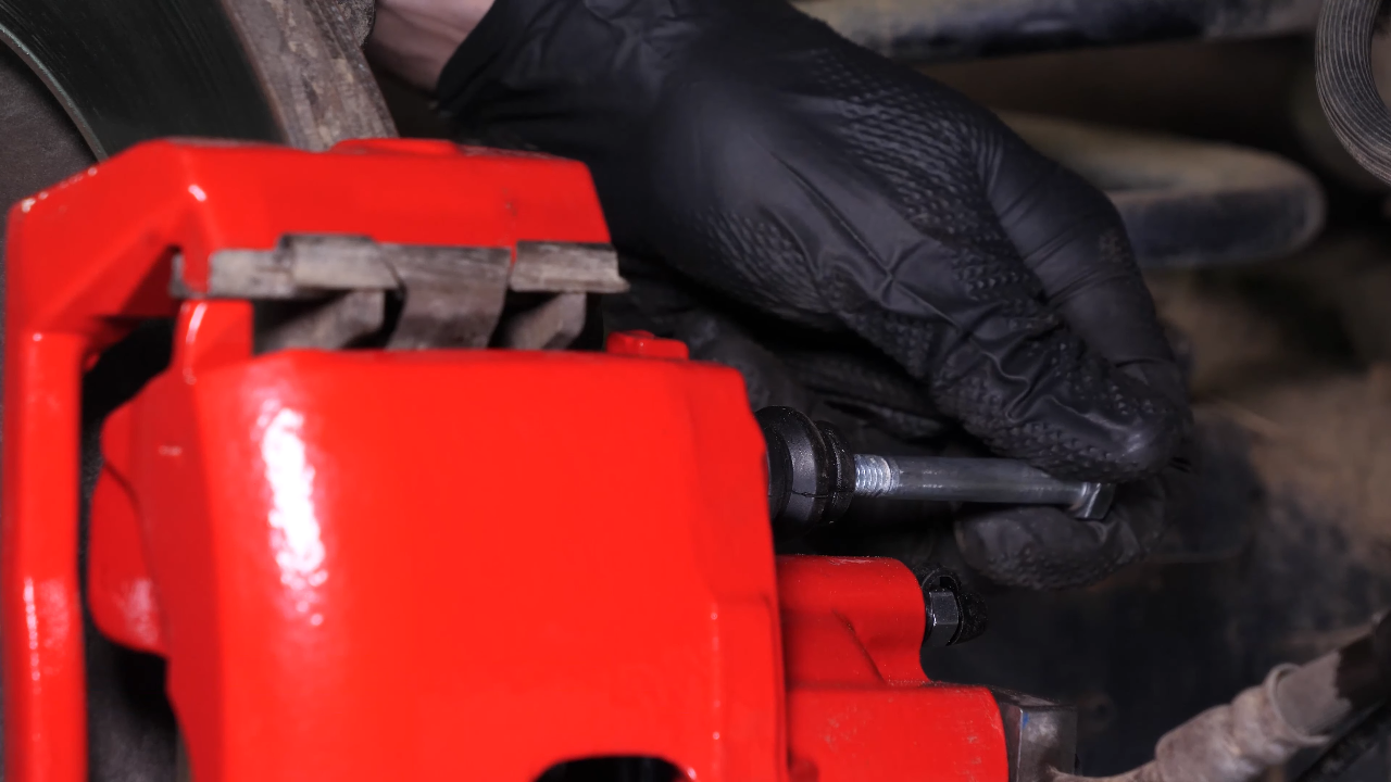 Remove the brake caliper