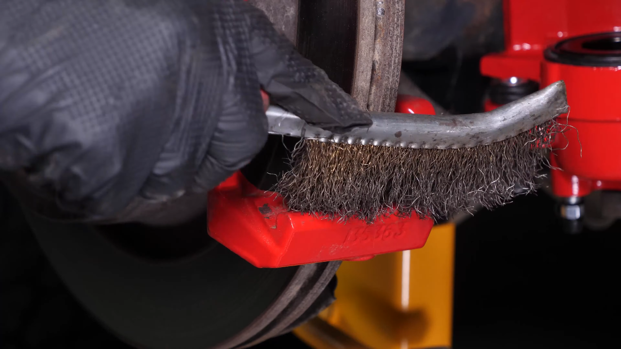 Clean the brake caliper mount