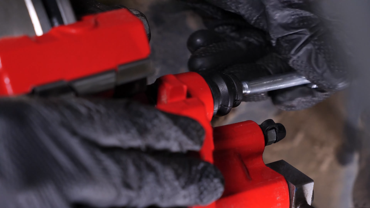 Put the brake caliper back