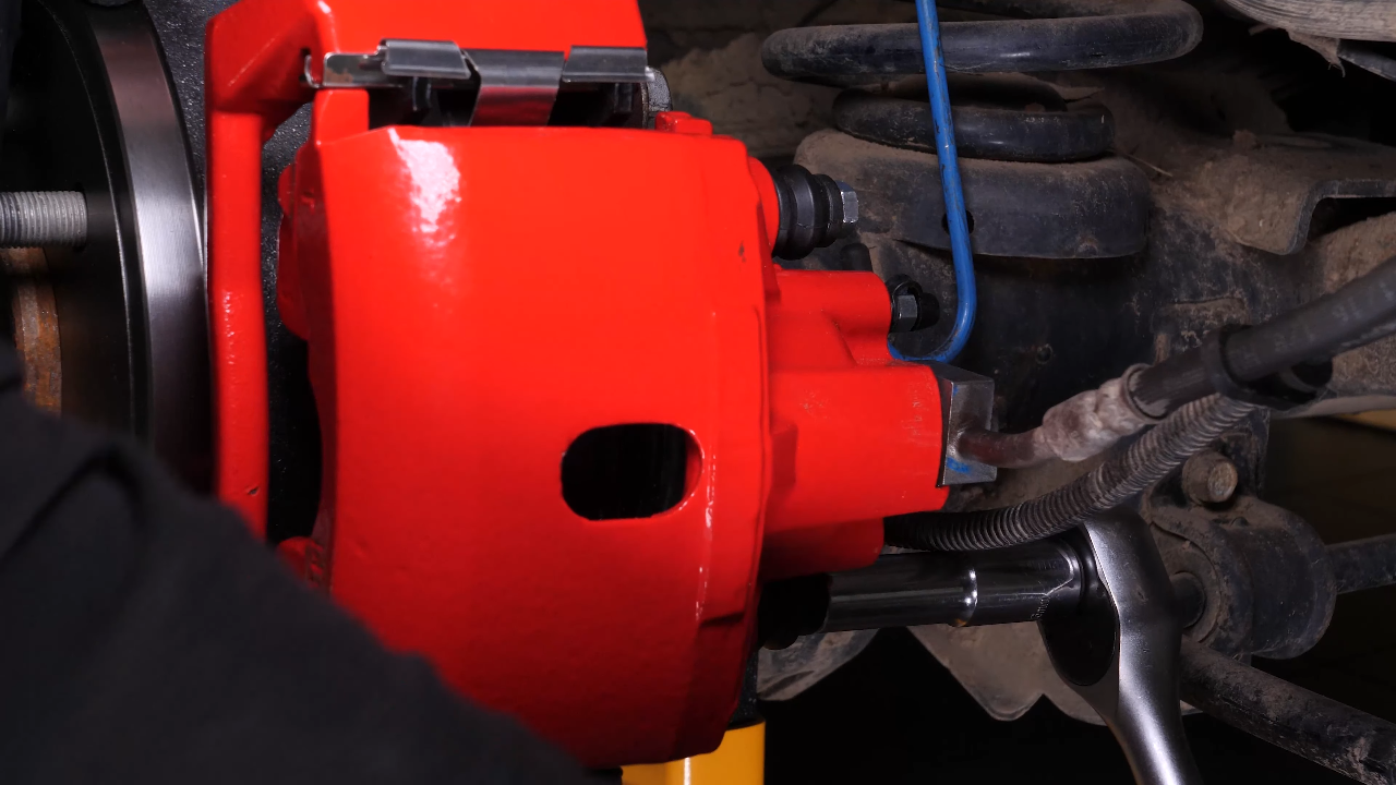 Put the brake caliper back