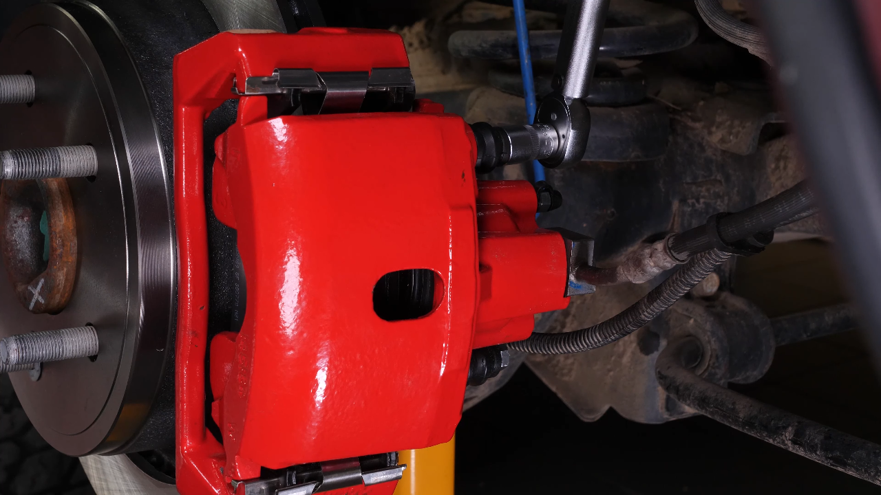 Put the brake caliper back