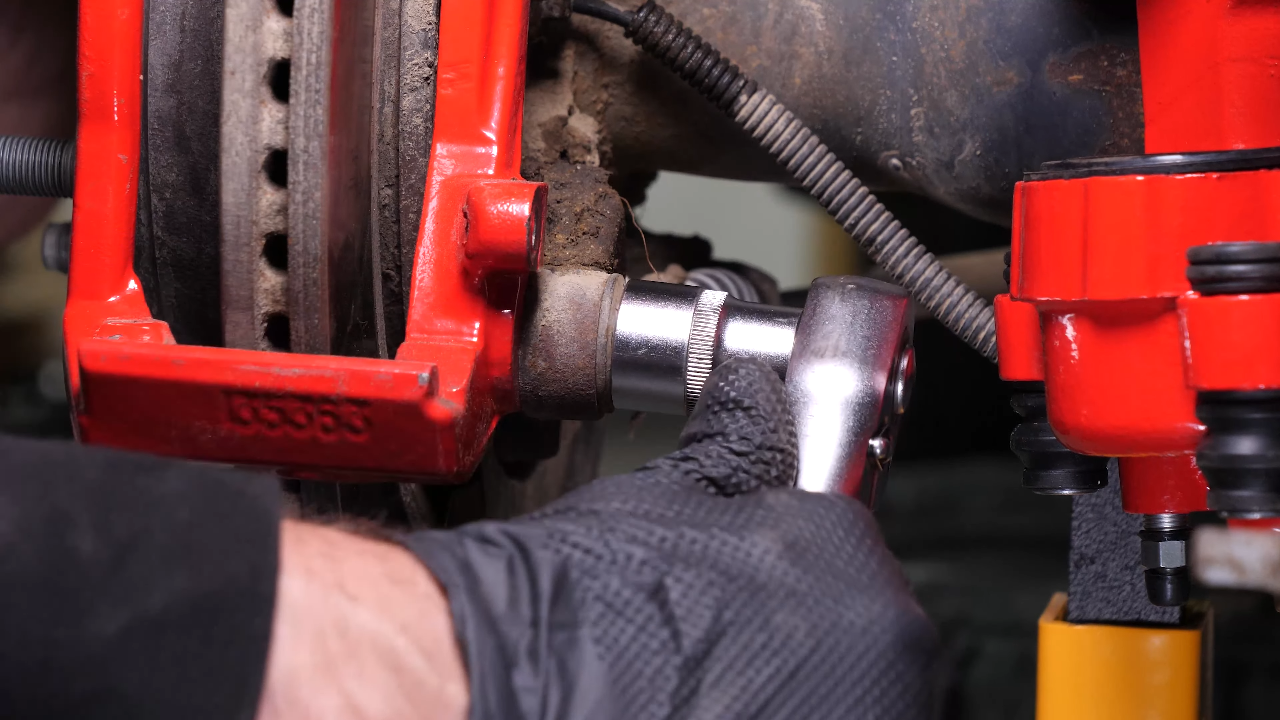 Remove the brake caliper mount