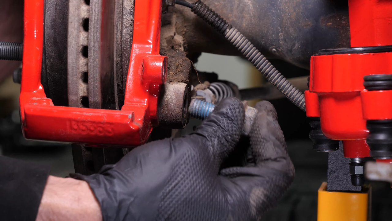 Remove the brake caliper mount