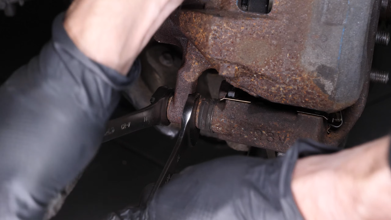 Put the brake caliper back