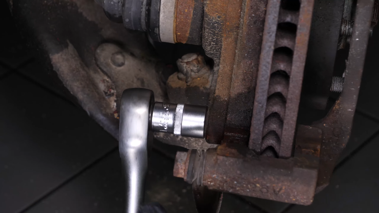 Remove the  brake caliper mount