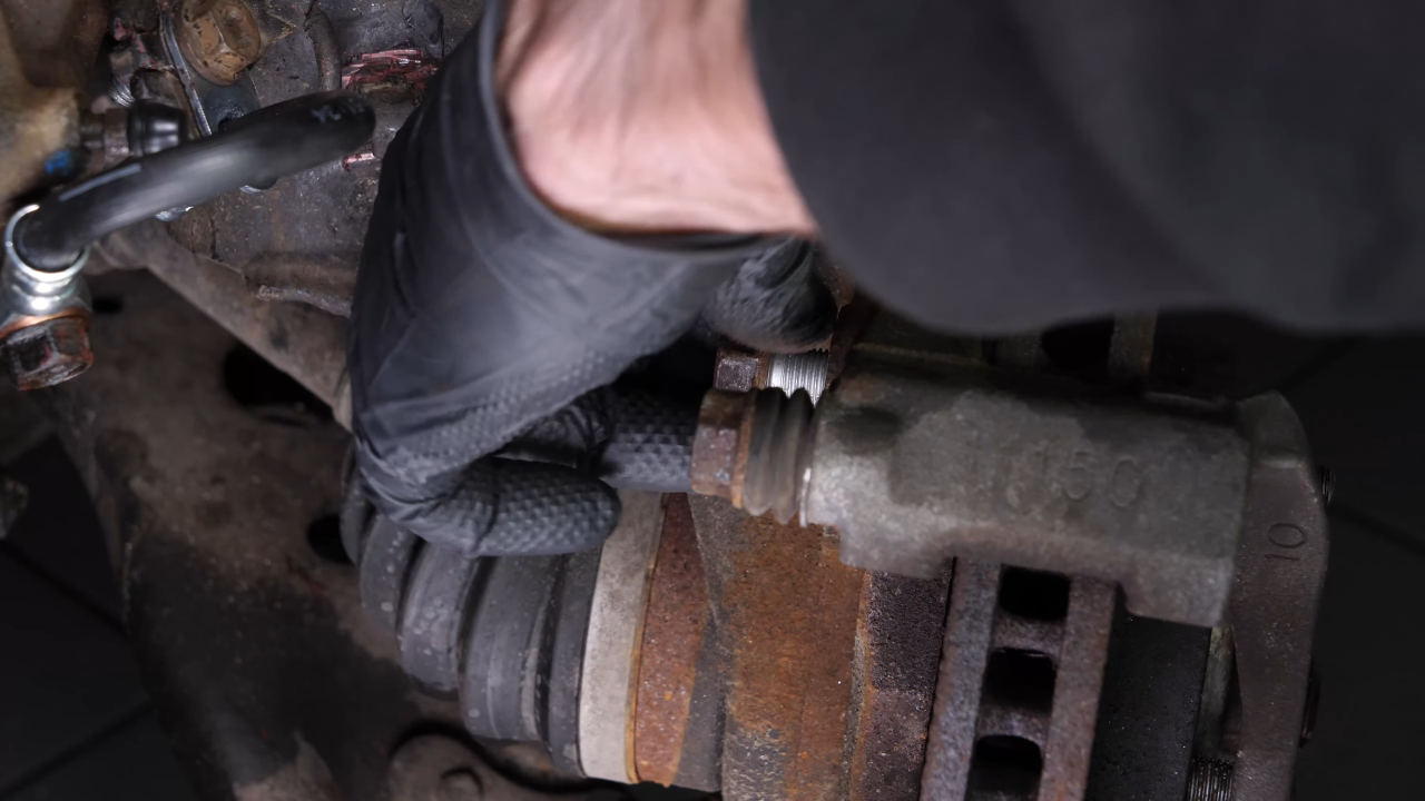 Remove the  brake caliper mount