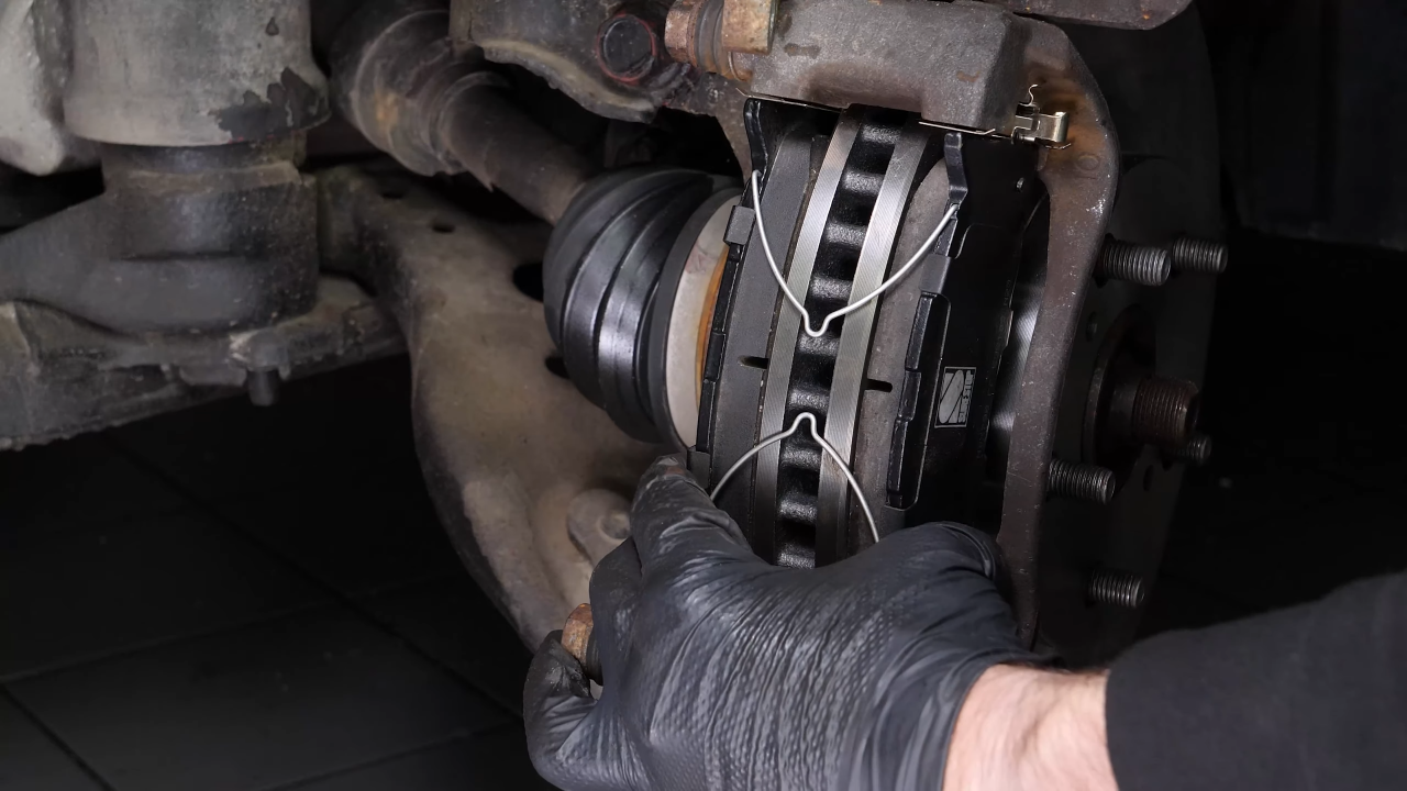 Put the brake caliper back
