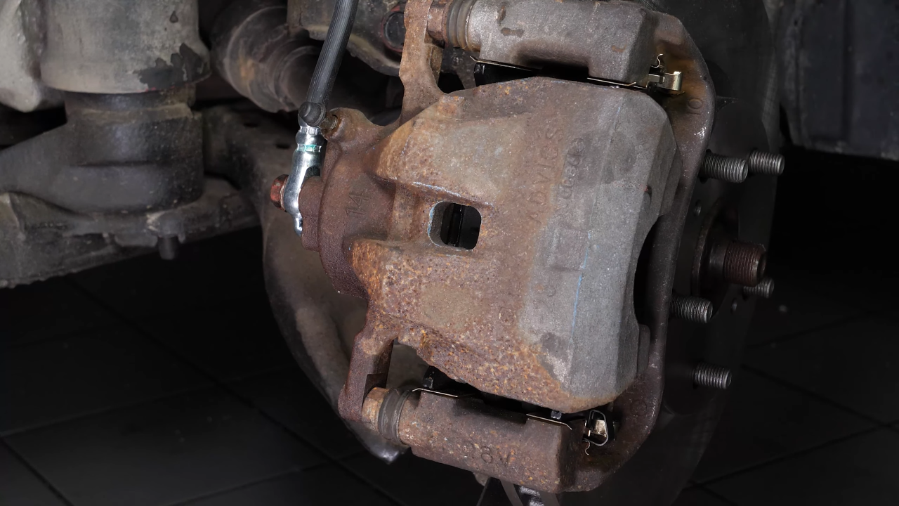 Put the brake caliper back
