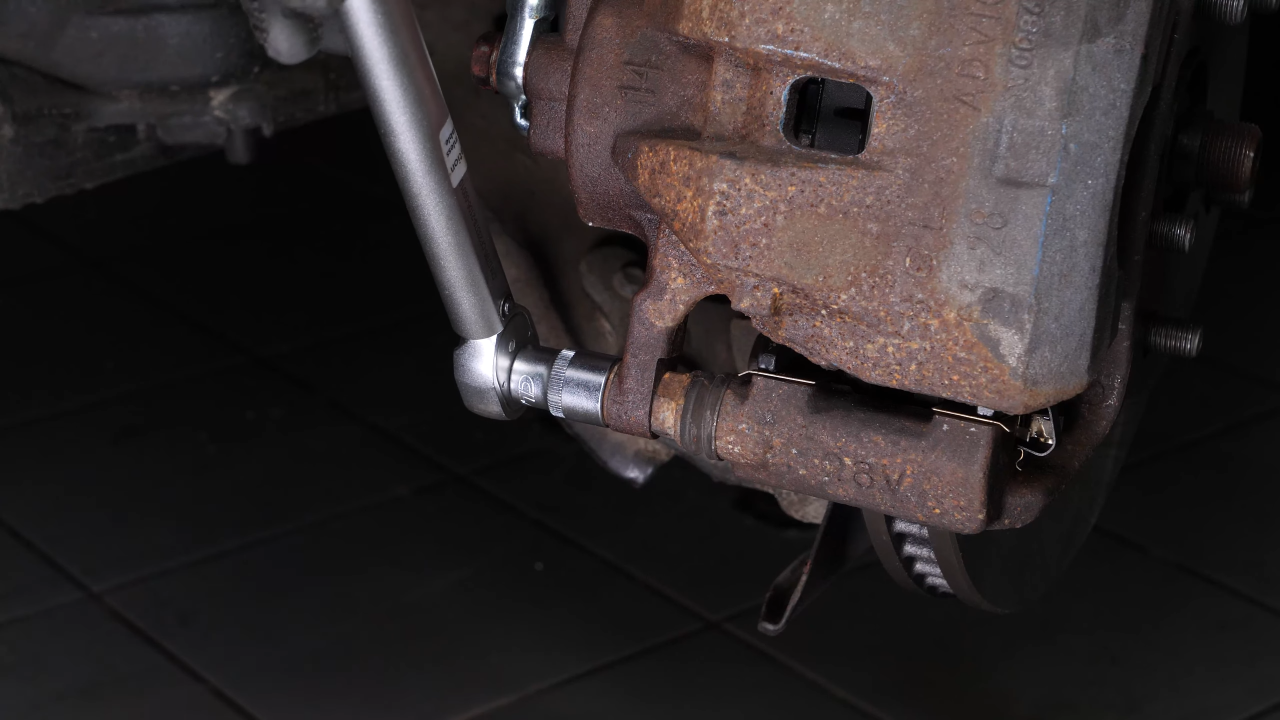 Put the brake caliper back
