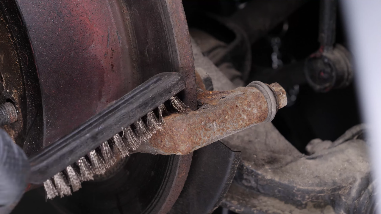 Clean the brake caliper mount