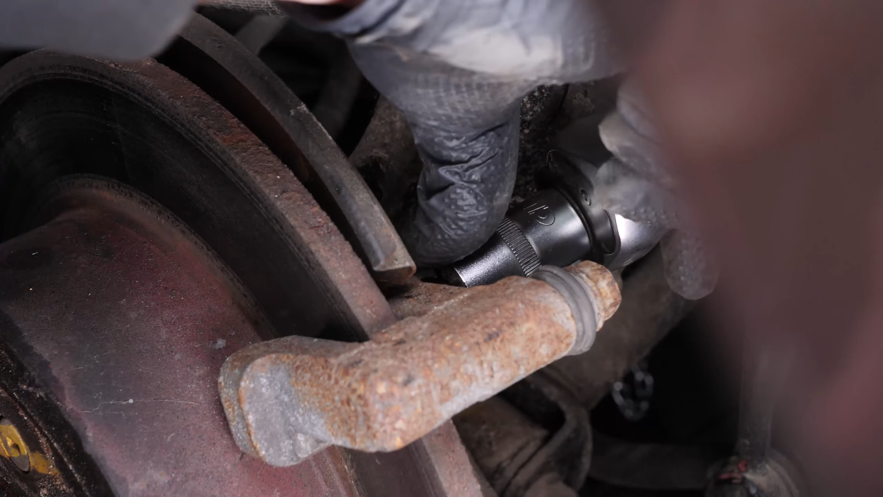 Remove the brake caliper mount