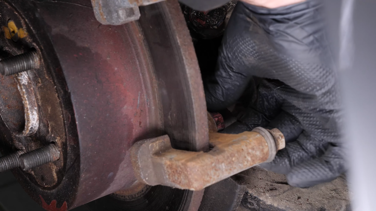 Remove the brake caliper mount