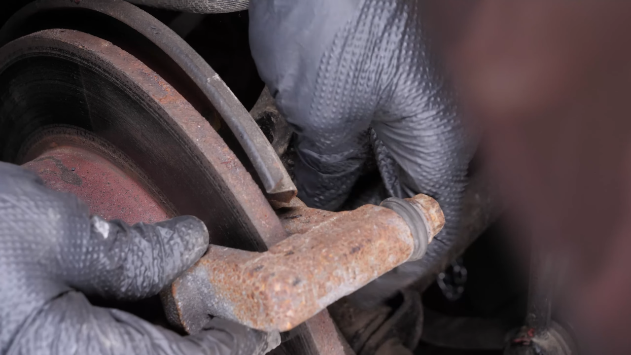 Remove the brake caliper mount