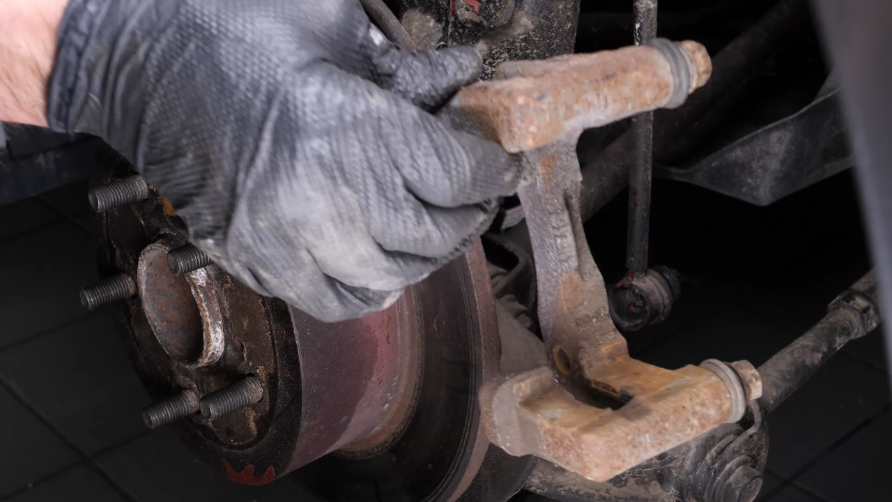 Remove the brake caliper mount