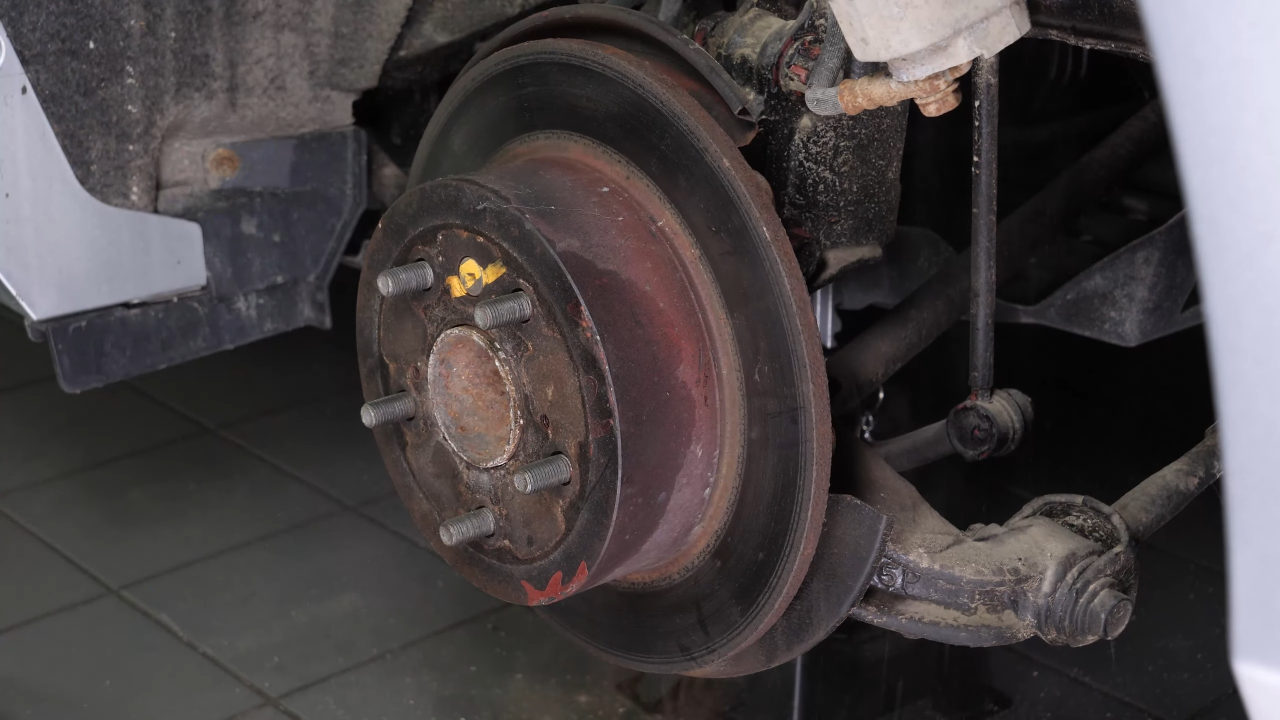 Remove the brake caliper mount