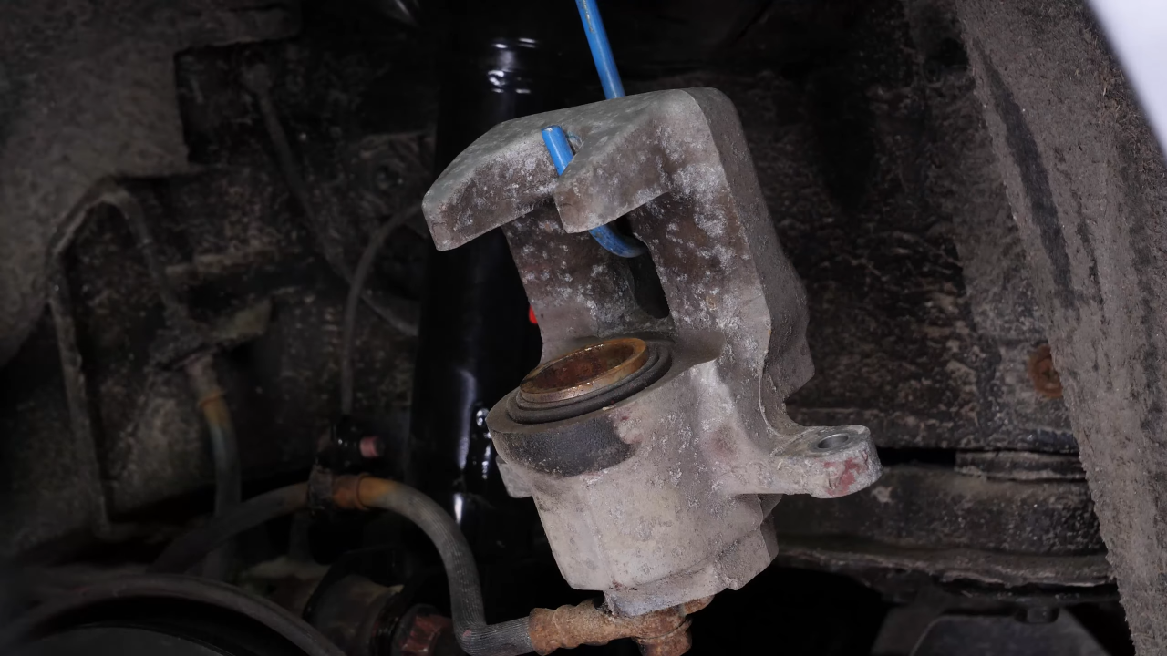 Put the brake caliper back