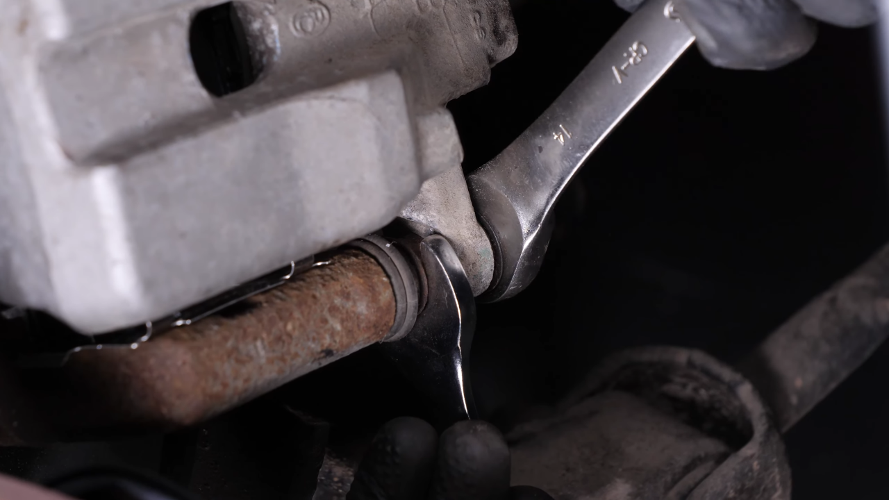 Put the brake caliper back