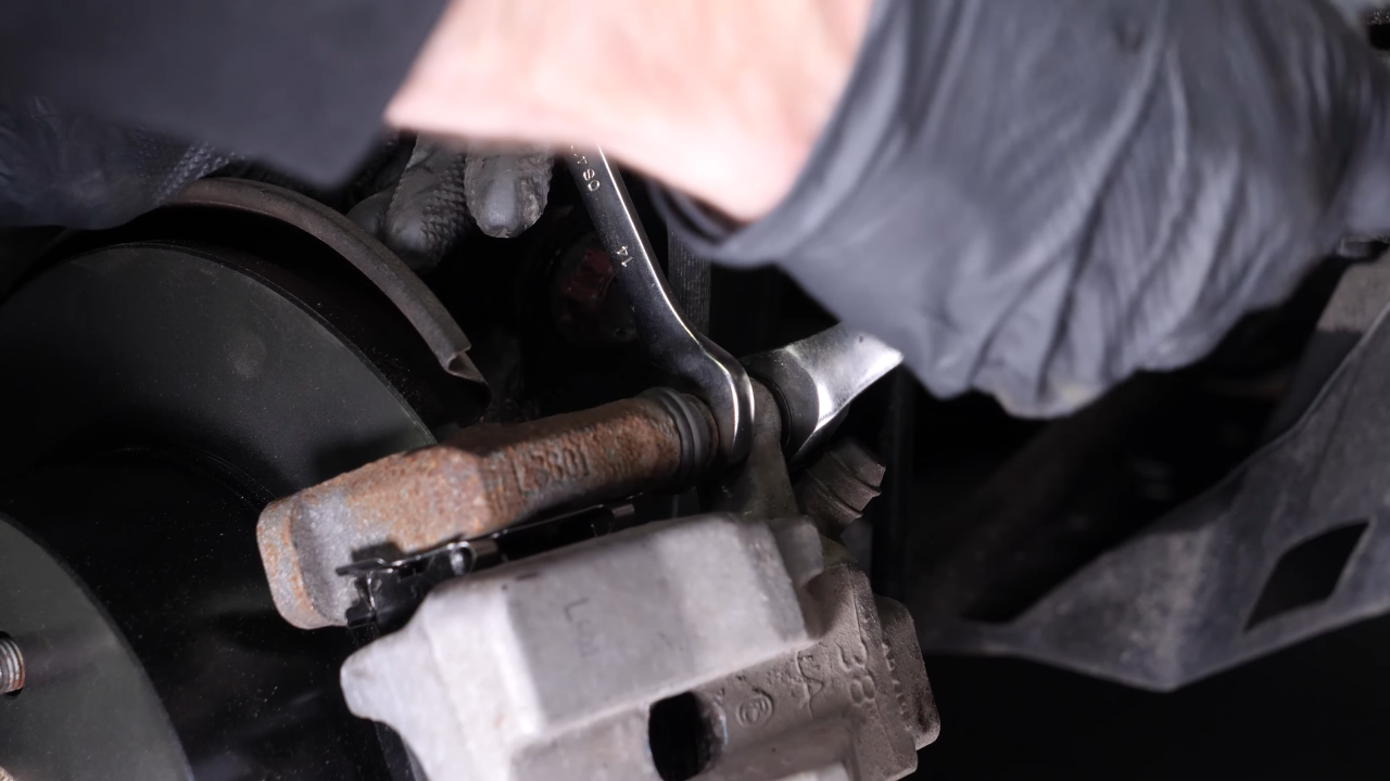 Put the brake caliper back