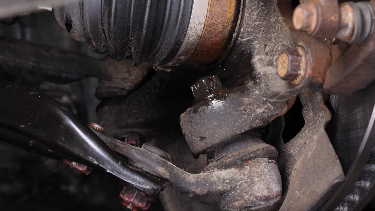 Loosen the lower ball joint upper nut