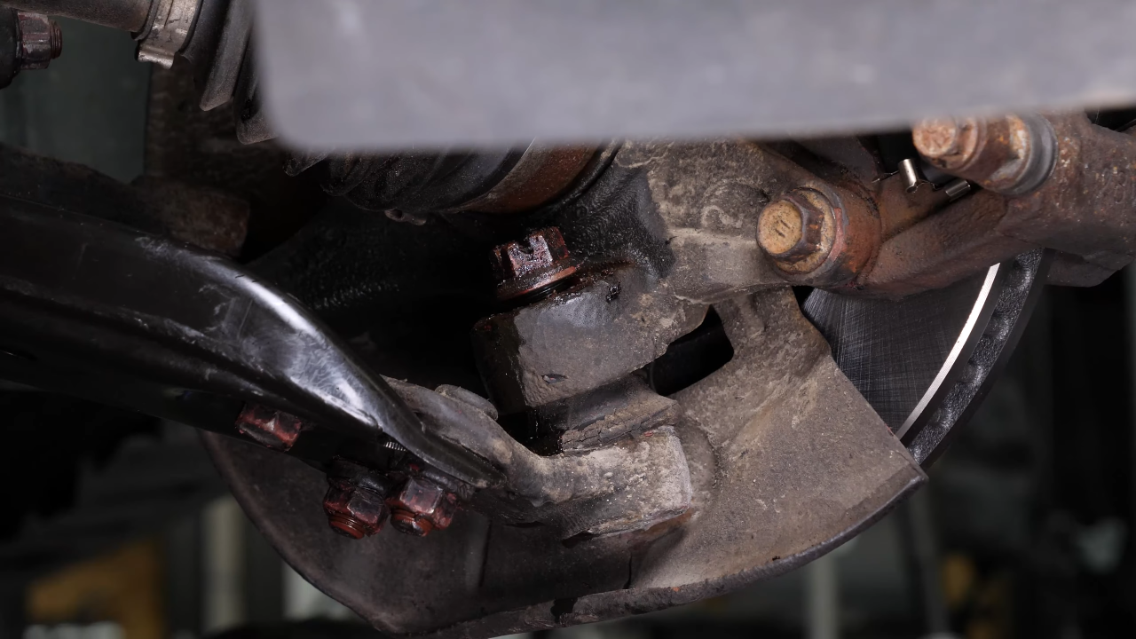 Loosen the lower ball joint upper nut