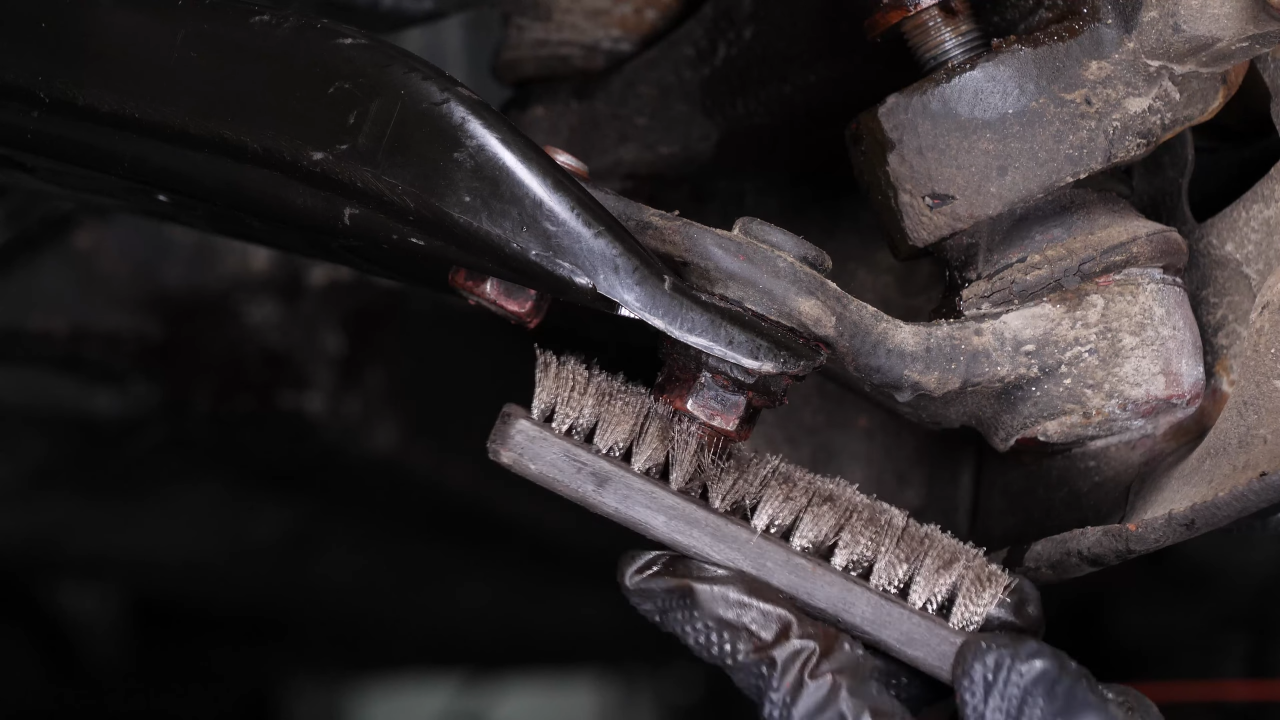 Remove the ball joint holding nuts
