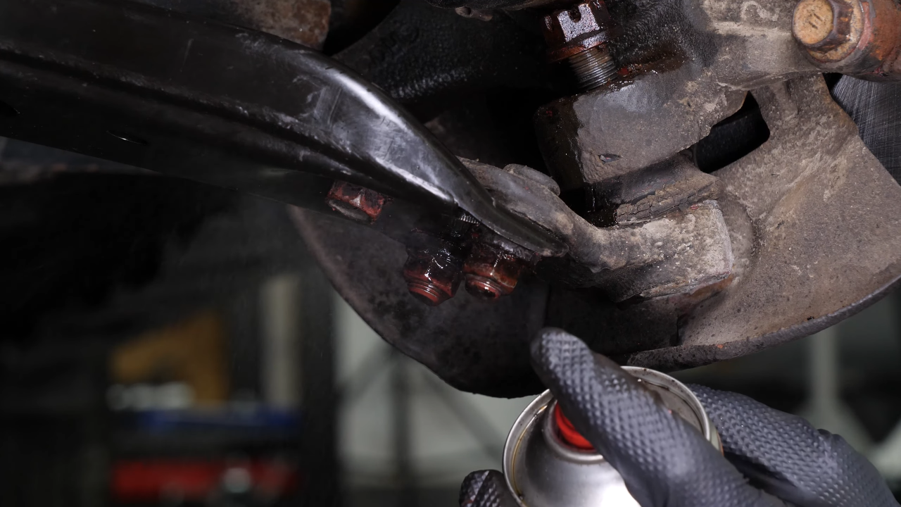 Remove the ball joint holding nuts