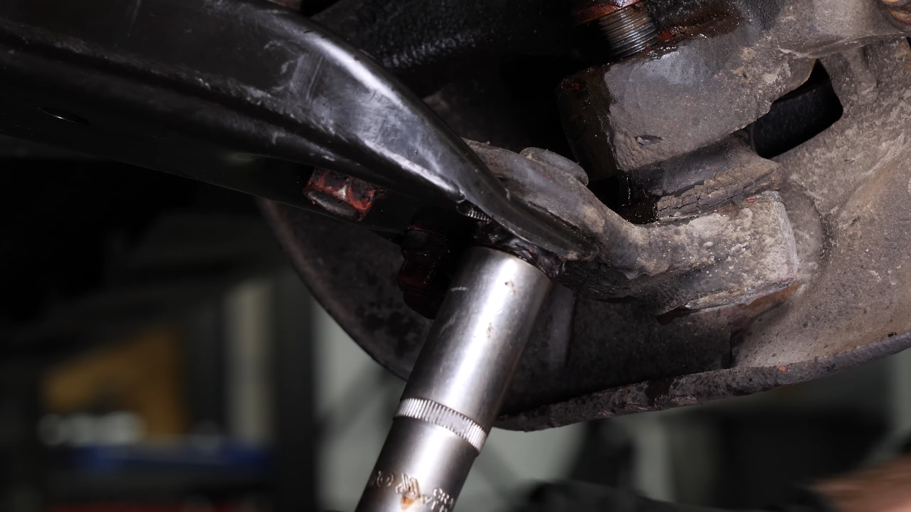 Remove the ball joint holding nuts
