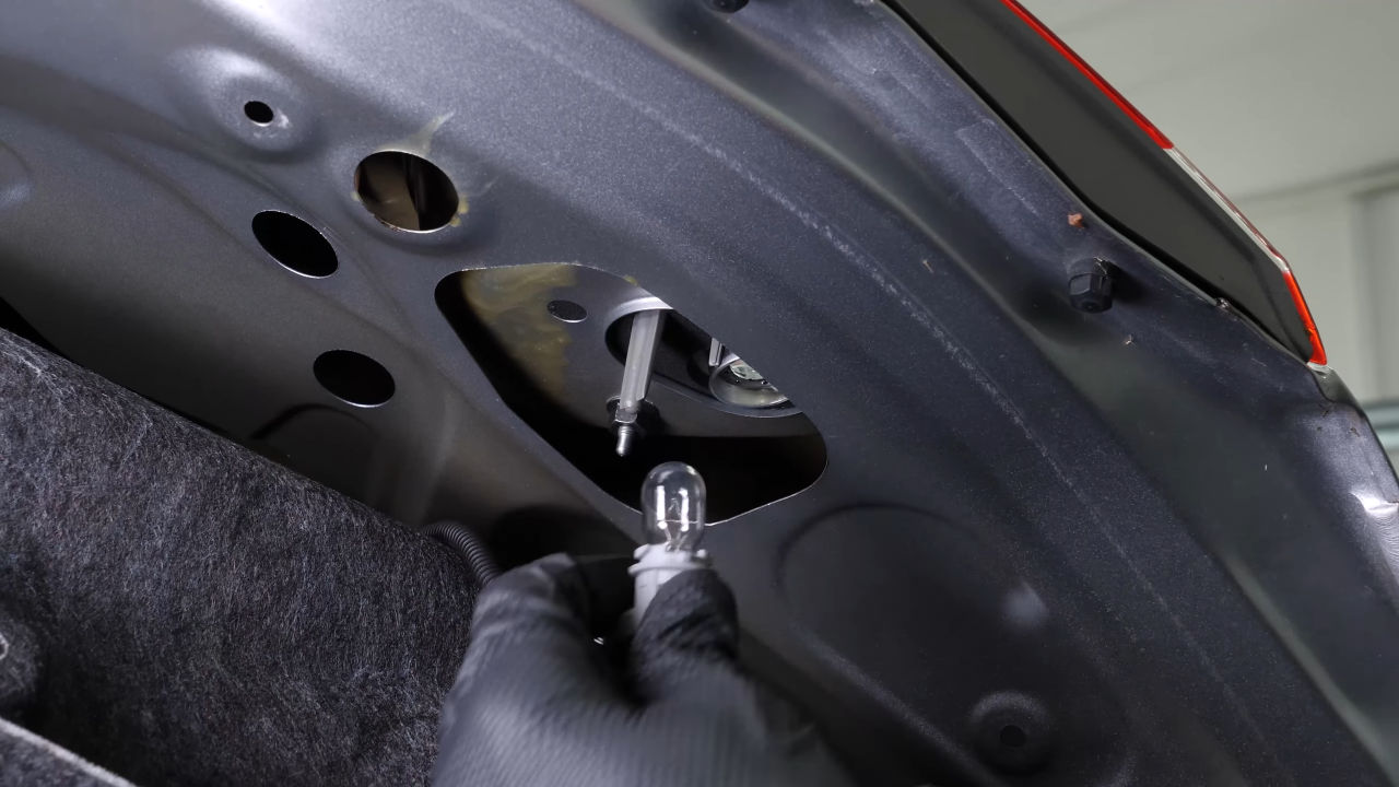 Replace the reverse light bulb