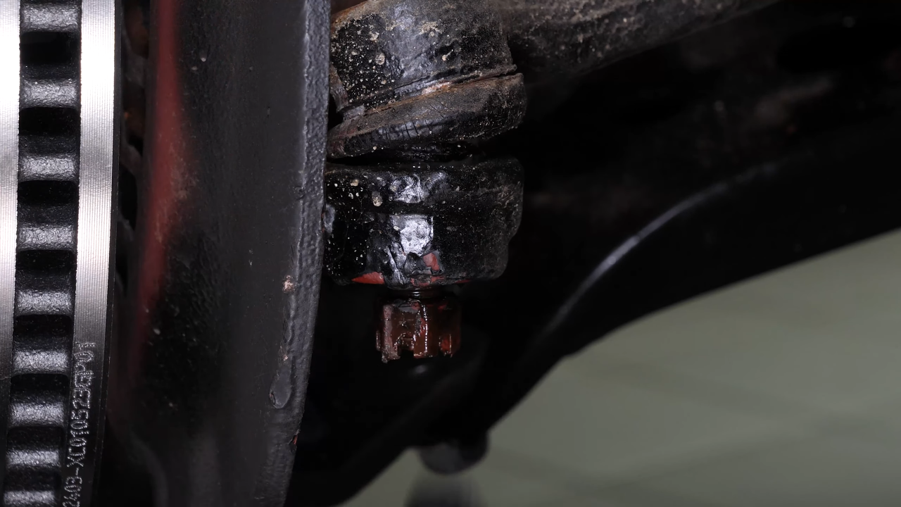 Loosen the holding nut