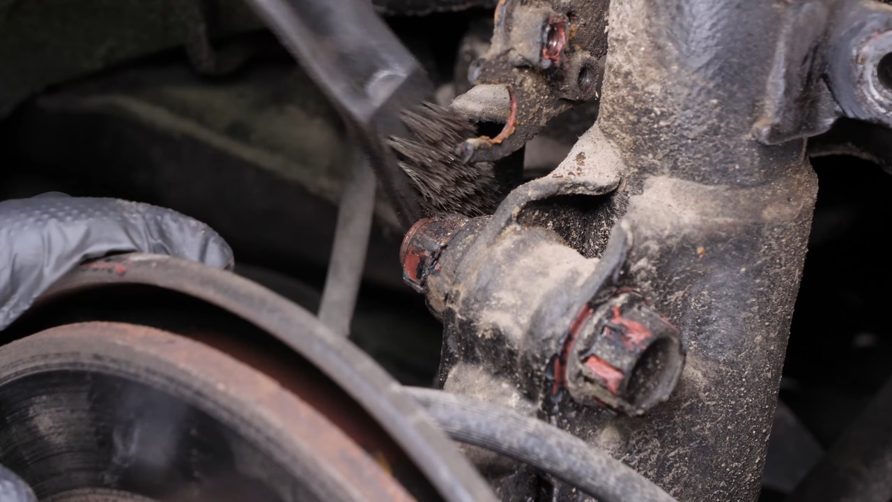 Unscrew the shock absorber foot