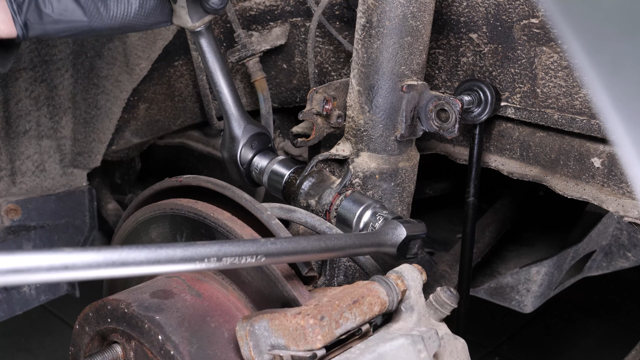 Unscrew the shock absorber foot