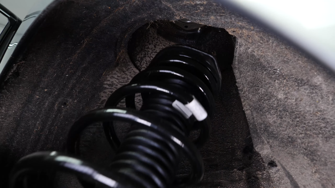 Install the new shock absorber