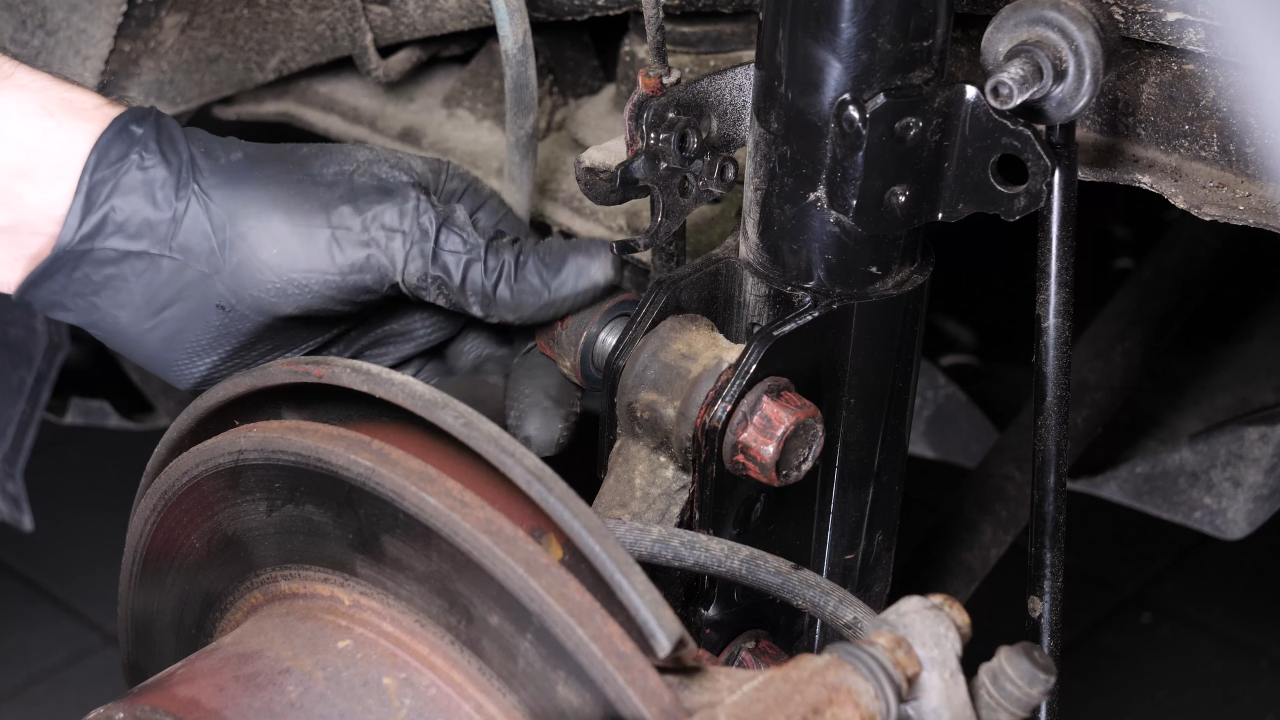 Install the new shock absorber