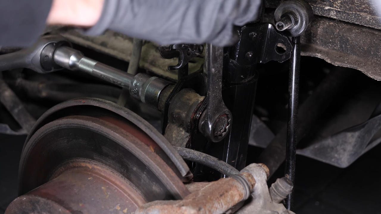 Install the new shock absorber