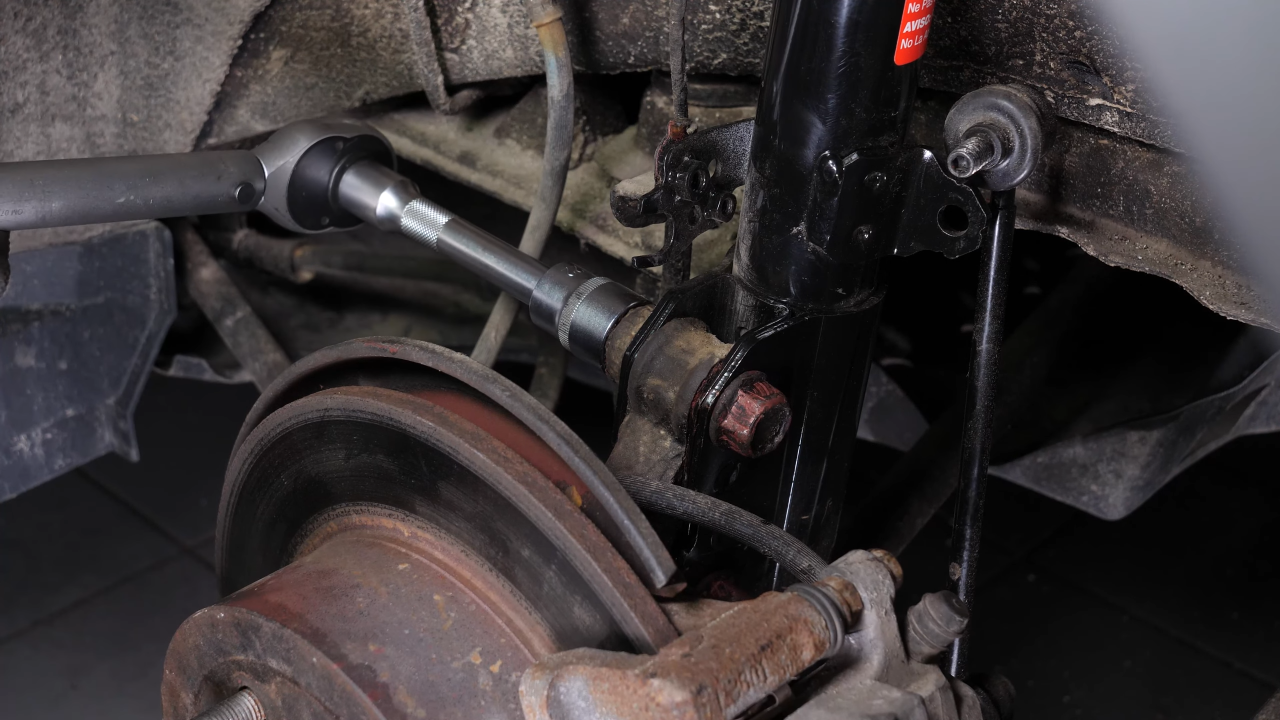Install the new shock absorber