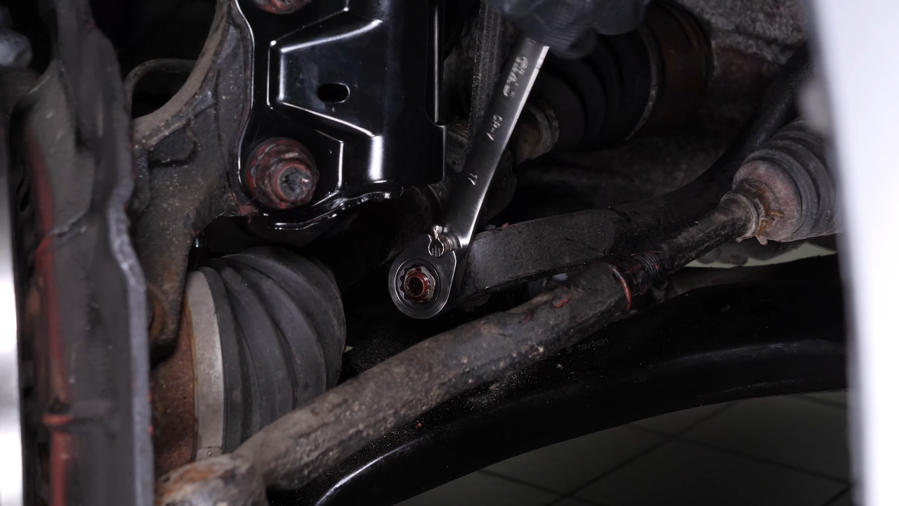 Unscrew the lower ball joint