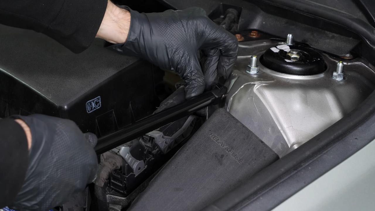 Install the new hood lift support