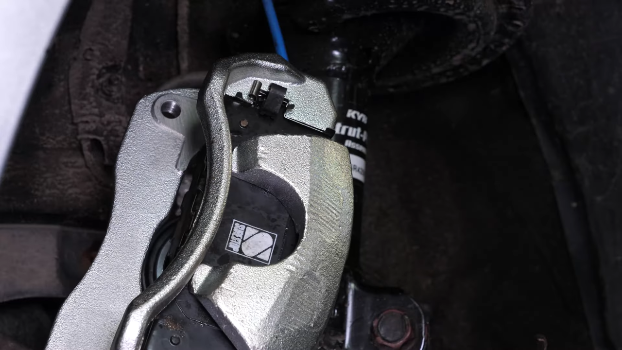 Remove the caliper assembly