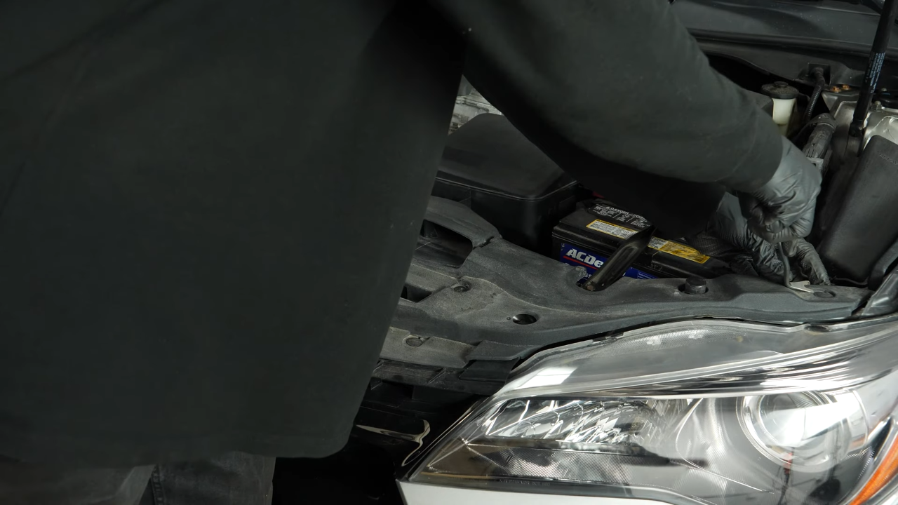 Remove the airbox-expansion tank assembly