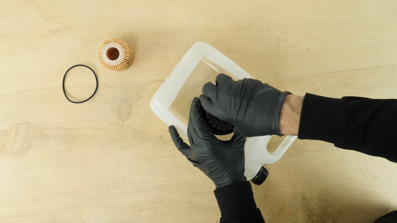 Clean the oil filter cap