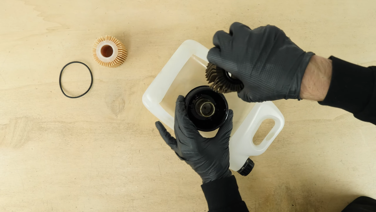 Clean the oil filter cap