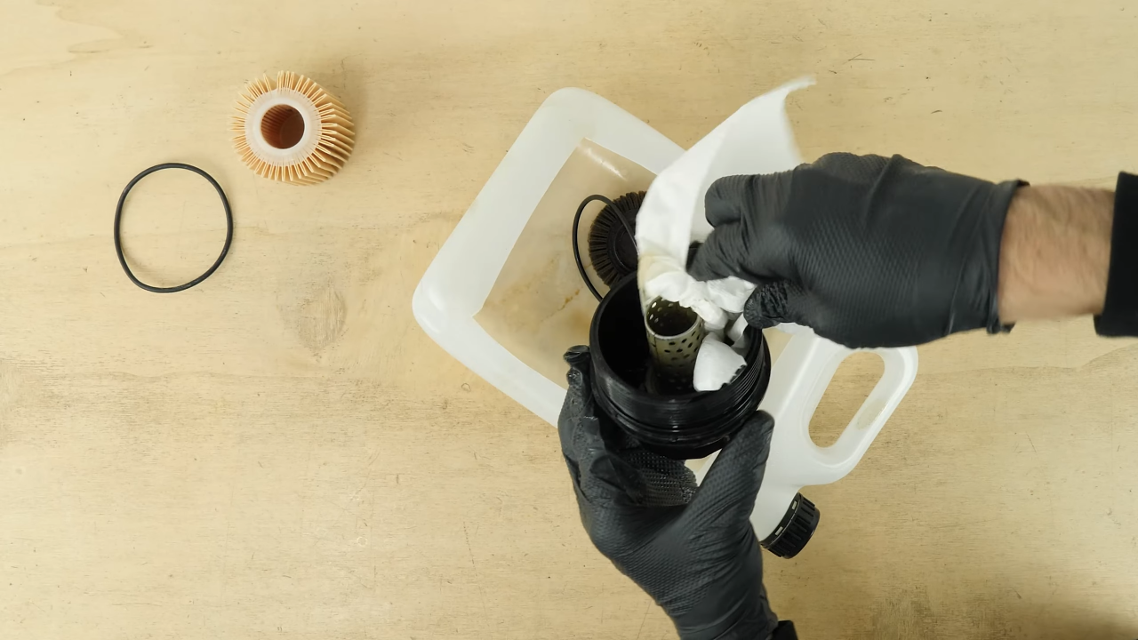 Clean the oil filter cap