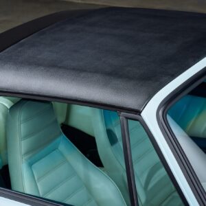 a 1984 porsche carrera targa parked showing the targa top