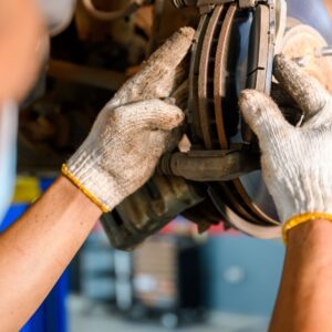 mechanic inspecting brake pads