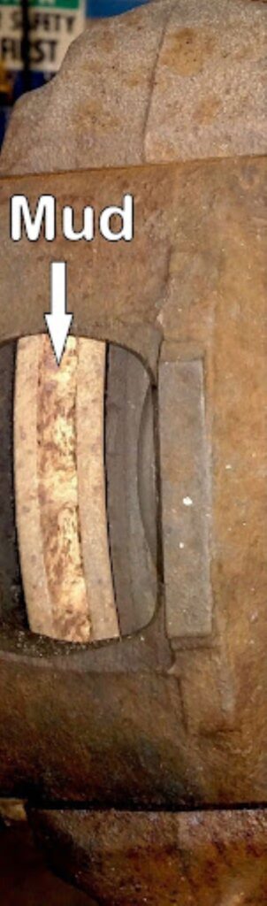 image of a brake rotor with mud