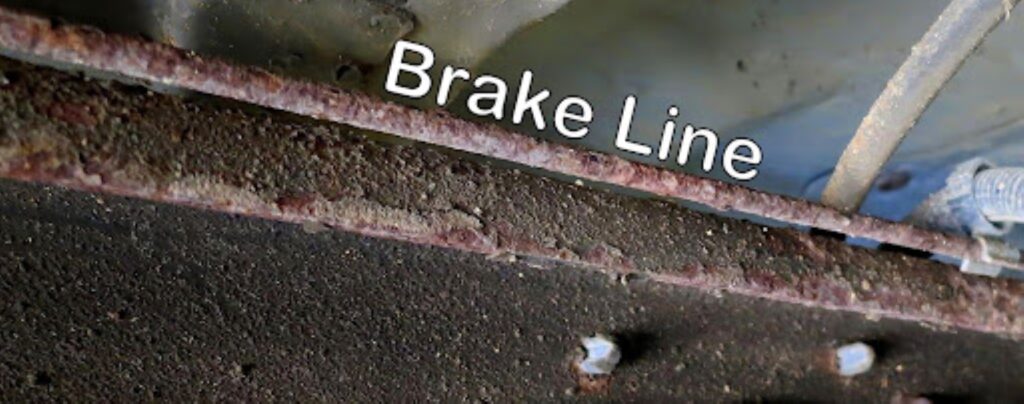close up shot of a rusty brake line