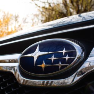 close up shot of a subaru logo in a car